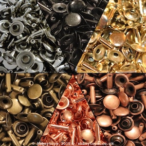 May include: Assortment of metal rivets in five colours: silver, black, gold, bronze, and copper. The rivets have a round head and a post for attaching to fabric or leather.