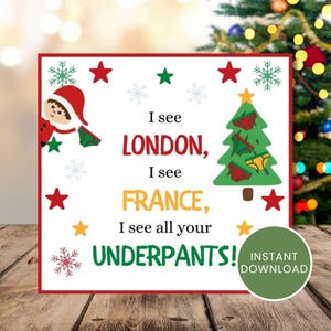 May include: A Christmas-themed card with a red border, featuring text that reads "I see LONDON, I see FRANCE, I see all your UNDERPANTS!". The card includes illustrations of a Christmas tree, stars, snowflakes, and a person in a Santa hat. A green circle with "INSTANT DOWNLOAD" is also present.