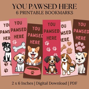 Może przedstawiać: Sześć drukowanych zakładek z uroczymi kreskówkowymi psami z tekstem "You Pawsed Here" na każdej zakładce. Zakładki mają rozmiar 5,1 cm x 15,2 cm.