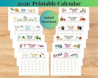 May include: A collection of printable 2026 calendars, each featuring a different month with decorative illustrations. The calendars are arranged on a wooden surface, with the text "2026 Printable Calendar" at the top and "Instant Download" in the center.