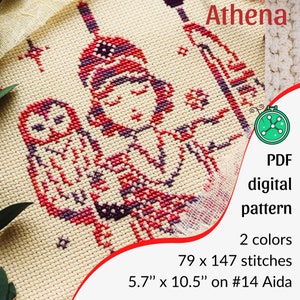 May include: Cross-stitch pattern featuring a figure with an owl, stitched in red and purple on a cream background. The text "Athena" is at the top. The pattern is 5.7" x 10.5" and uses 2 colors. The image also includes the text "PDF digital pattern".