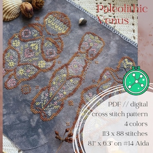 May include: A cross stitch pattern titled Paleolithic Venus featuring three stylized figures stitched in brown, pink, and yellow thread on a mottled gray fabric. The text reads PDF // digital cross stitch pattern, 4 colors, 113 x 88 stitches, 8.1" x 6.3" on #14 Aida.
