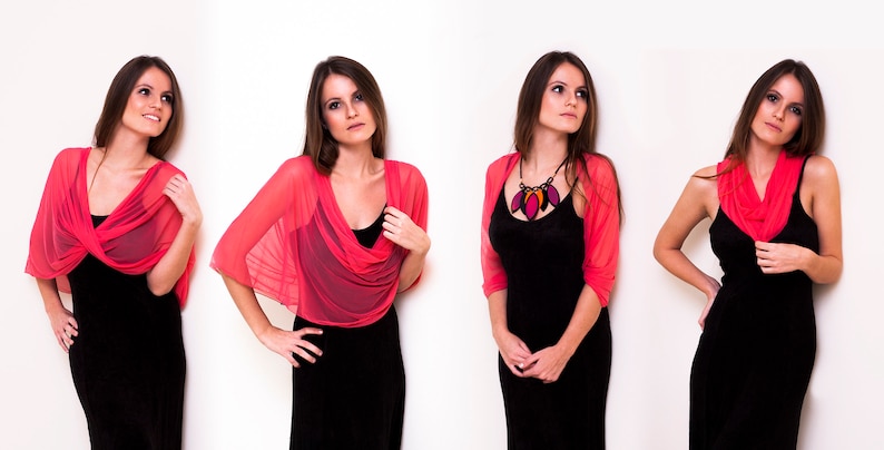 May include: Four women wearing different styles of a pink sheer shawl. The shawl is worn as a top, a scarf, and a wrap. The women are wearing black dresses.
