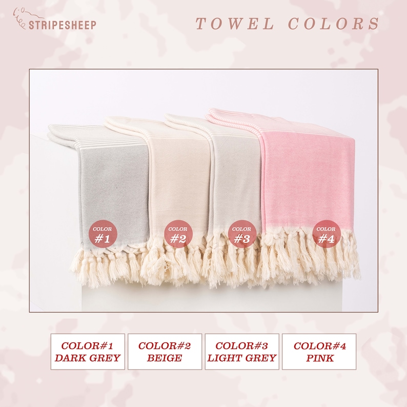May include: Four Turkish towels in different colors: dark grey, beige, light grey, and pink. The towels are folded and arranged in a row. Each towel has a label with a color number and name.