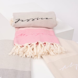 May include: Three striped towels with fringe, each with a different name embroidered on them. The names are "Jessica", "Mary", and "Abby".