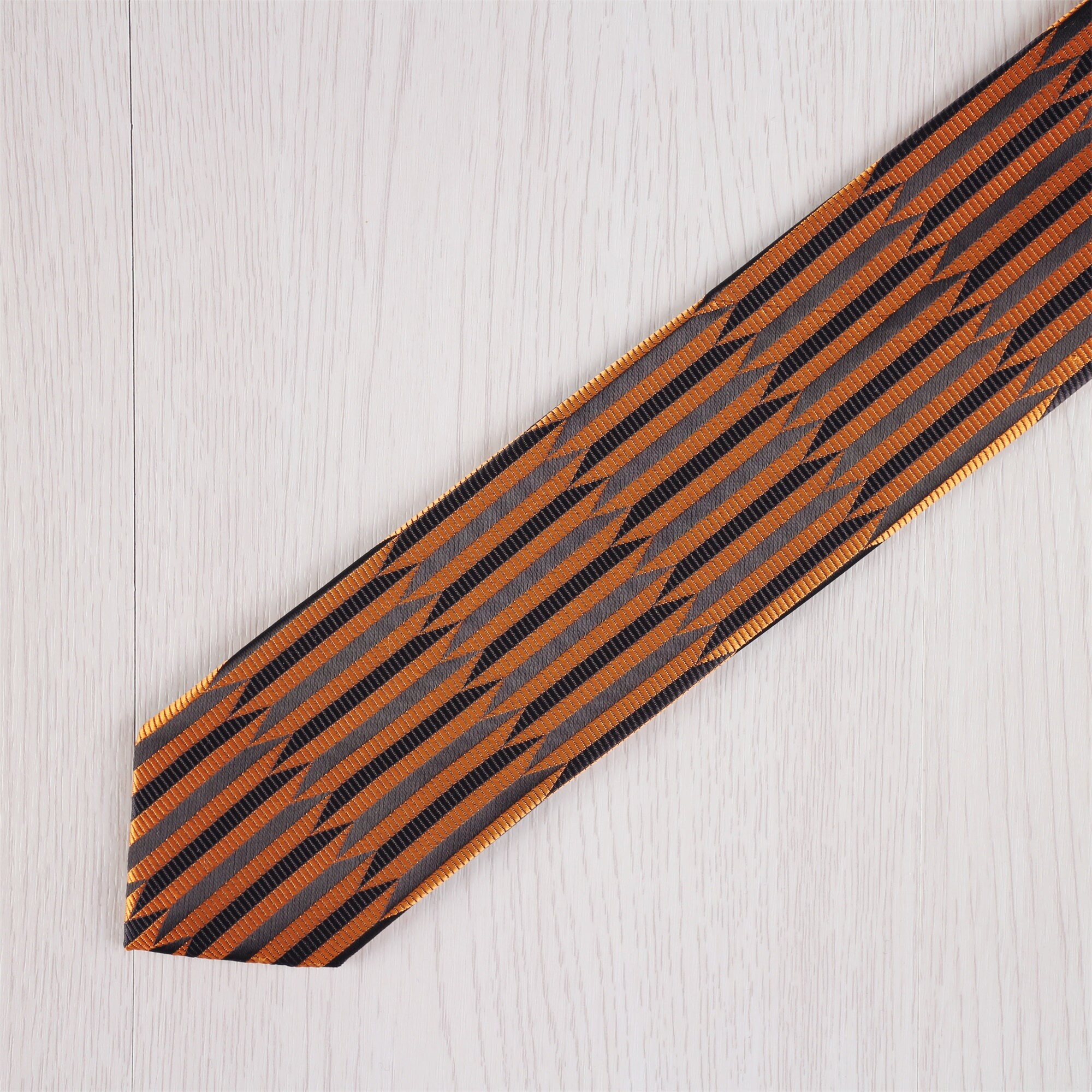 burgundy shirt with gold tie