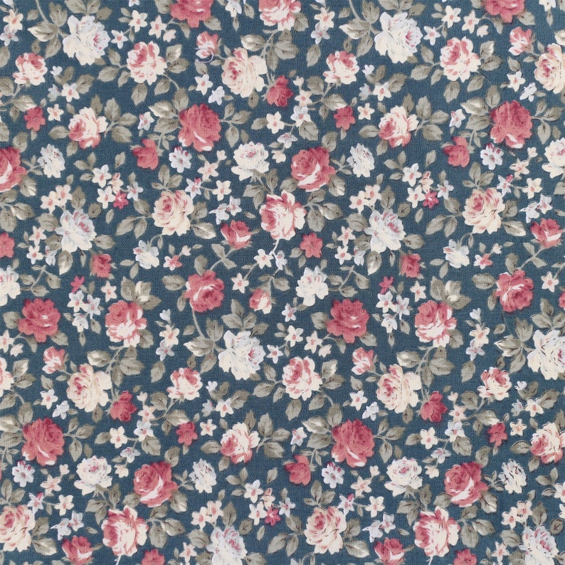 May include: A seamless fabric pattern with a repeating design of pink and white flowers on a dark blue background.