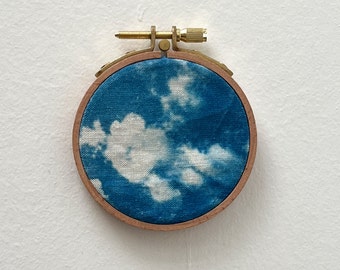 Cloud cyanotype on fabric stretched over an embroidery hoop - handmade