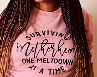 Surviving Motherhood One Meltdown at a Time Funny Mom Life Shirt