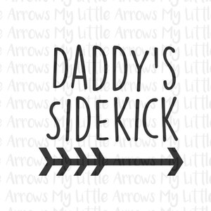 May include: Black and white graphic design with the text "Daddy's Sidekick" and a black arrow pointing to the right. Below the arrow is the text "my little arrows" with a heart symbol on each side of the word "little".