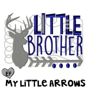 May include: Embroidered design featuring a gray deer head, blue text that reads "Little Brother", and a gray arrow with blue dots. The text "My Little Arrows" is below the design.