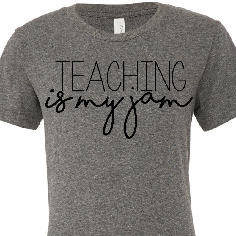 May include: A heather gray t-shirt with black text that reads "TEACHING is my jam".