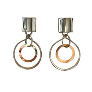 May include: A pair of silver earrings with a square top and two circles hanging from it. The inner circle is copper.