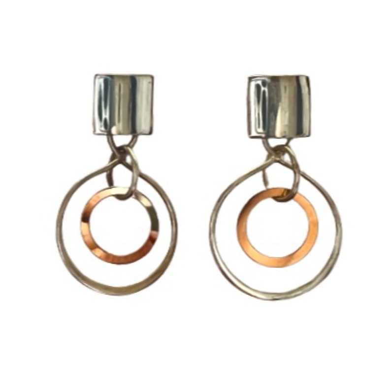May include: A pair of silver earrings with a square top and two circles hanging from it. The inner circle is copper.