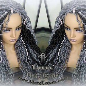 May include: A long, wavy wig with black and gray dreadlocks. The wig is styled with silver beads and is worn on a mannequin head.
