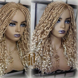 May include: A blonde braided wig with curly ends is displayed on a mannequin head. The wig features a combination of tightly woven braids and loose, flowing curls. A gold-colored necklace with a pendant is visible. The image is well-lit, showcasing the wig's texture and style.