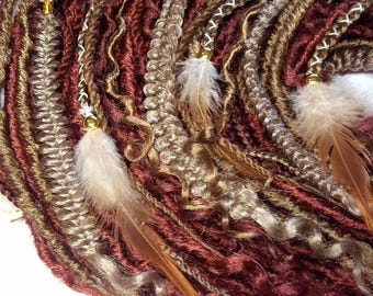 May include: A collection of brown, blonde, and burgundy synthetic dreadlocks with gold beads and feathers.
