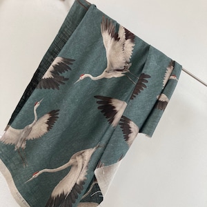 AZZURO* Dream half linen with cranes in petrol tones/sold by the meter/fabric/tissu/fabric/textile/toile de line/linen/CARLUCCI