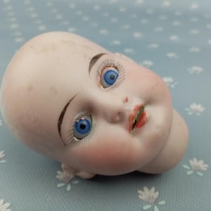 Poupée ancienne tete en biscuit de porcelaine DEP 11 yeux