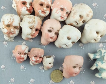 Excavated antique Dolls Heads, German porcelain doll heads, glass eyes doll heads, doll parts of various sizes and styles, Damaged parts