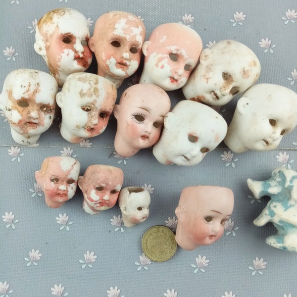 Excavated antique Dolls Heads, German porcelain doll heads, glass eyes doll heads, doll parts of various sizes and styles, Damaged parts