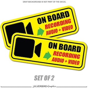 May include: A set of two yellow and black warning decals with the text "On Board Recording Audio + Video" and a black camera icon. The decals are for use on vehicles.
