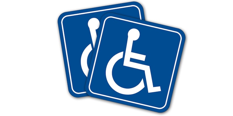 May include: Two blue square stickers with white outlines and a white wheelchair accessibility symbol.