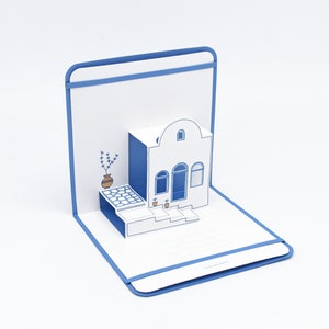 Biglietto pop-up di Santorini - Biglietto d'auguri kirigami delle Cicladi - Souvenir estivo delle isole greche - Arte della carta con l'architettura dell'Egeo