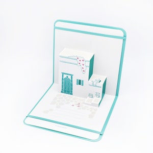Carte pop-up Rhodes - Carte de voeux kirigami du Dodécanèse - Souvenirs d'été des îles grecques - Ruelles de la mer Égée, chats et souvenir d'architecture