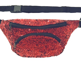 May include: A red sequined fanny pack with a black zipper and adjustable strap.