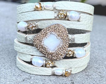 Pearlescent Split Leather Cuff Bracelet with Mother of Pearl Centerpiece Encrusted with Citrine Crystals.