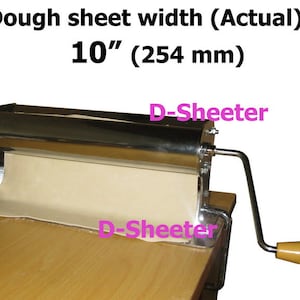 May include: A stainless steel dough sheeter with a wooden handle. The machine is shown with a sheet of dough, and the text reads "Dough sheet width (Actual): 10" (254 mm)."