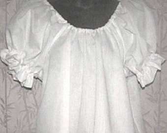 May include: A white peasant blouse with short, gathered sleeves. The blouse has a round neckline and a loose, flowing fit.