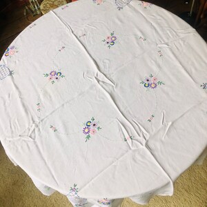 A vintage Tablecloth, embroidered flowers, floral, large, rectangular, blue, pink, purple, green, yellow, 1940s.