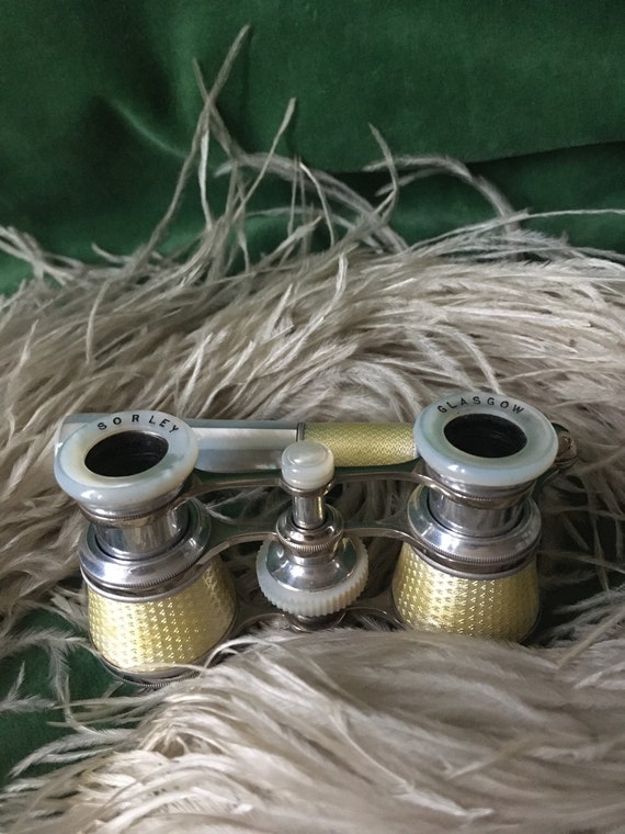 An Art Deco pair of Opera Glasses, yellow enamel a