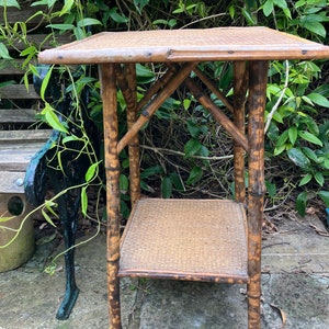 A bamboo table, wood and rattan, square, vintage, strong,water mark to top, lower shelf.