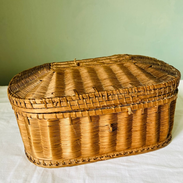 A sewing basket, box, wicker, antique, red padded buttoned lining.