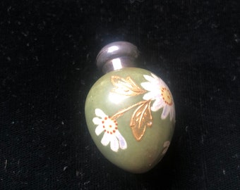 A scent bottle, antique, egg shaped, green with hand painted white flowers, ceramic, silver top, Birmingham 1888, Gervase Wheeler, perfume,