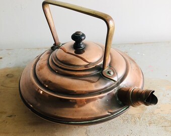 A copper kettle, Benham and Froud, arts and craft, Victorian, brass handle, round, stamped.