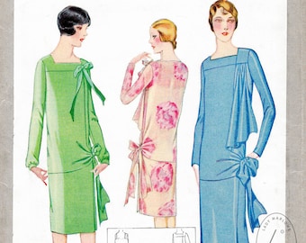 May include: A vintage sewing pattern for a two-piece dress. The pattern is for ladies and misses and is printed on a white background with black text. The pattern number is 4947 and the price is 50 cents. The pattern shows three different styles of the dress, one in green, one in pink and one in blue.