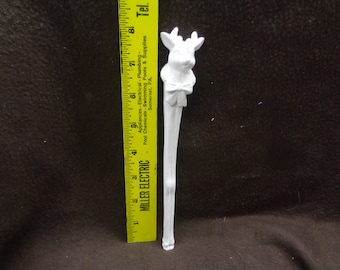 May include: White ceramic reindeer ornament with a bow tie. The ornament is approximately 8 inches tall.