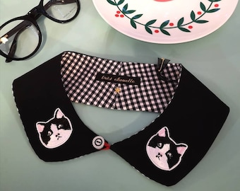 Black Peter Pan collar featuring two tuxedo-cat patches.