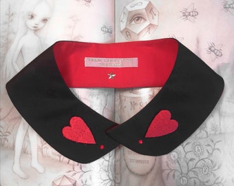 Black Peter Pan collar featuring two red hand-embroidery heart patches and crystal rhinestones.