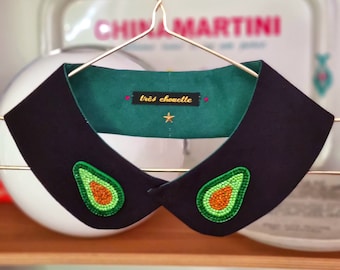 Peter Pan collar featuring two sparkling avocado patches.