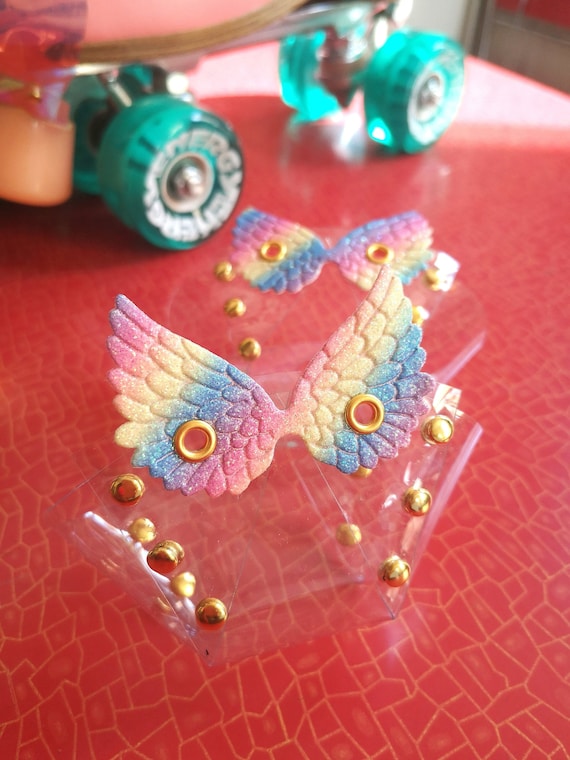 Transparent PVC Roller Skate Toe Guards with rainbow wings.