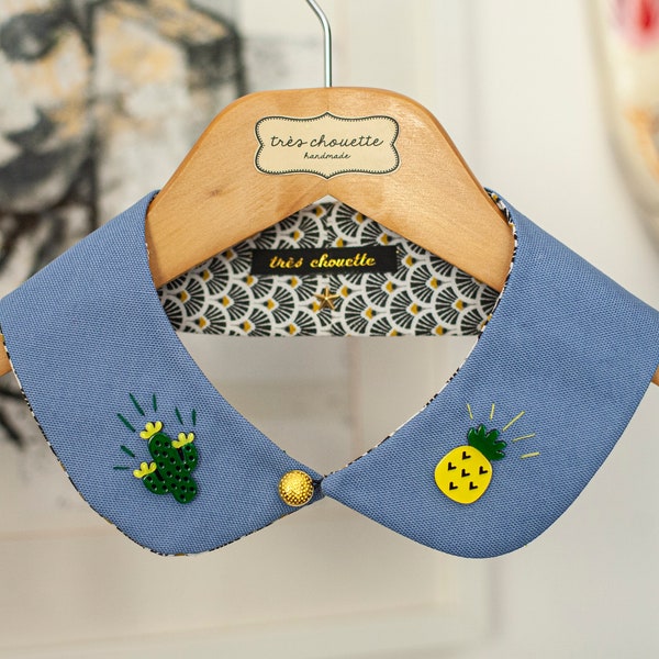 Dusty blue Peter Pan collar featuring acrylic cactus and pineapple beads. With golden button.