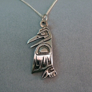 Sterling Silver Raven Pendant, Lost wax, design 613 is 1 inch long and 1/2 inch wide. Comes with an 18 inch Sterling chain.