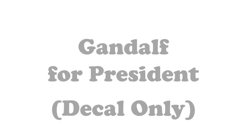 May include: Gandalf for President (Decal Only) - A gray decal with the text "Gandalf for President (Decal Only)"