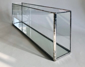 Long glass candle box in a stylish minimalist design
