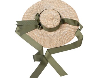 Le designer européen et américain duds grands avant-toits plat chapeau de paille ruban nœud papillon bord de mer vacances beach hat en été de femme